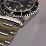 2002 Rolex Submariner 14060M with Roles Service Certificate