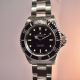 2002 Rolex Submariner 14060M with Roles Service Certificate