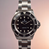 2002 Rolex Submariner 14060M with Roles Service Certificate